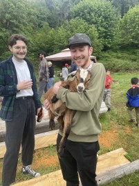 Michael holding baby goat